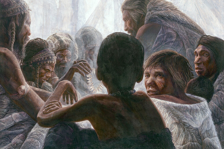 Rappresentazione artistica Sapiens e Neanderthal rannicchiati insieme all 'interno di una grotta. KENNIS &amp; KENNIS/MSF/SCIENCE SOURCE - RIPRODUZIONE RISERVATA